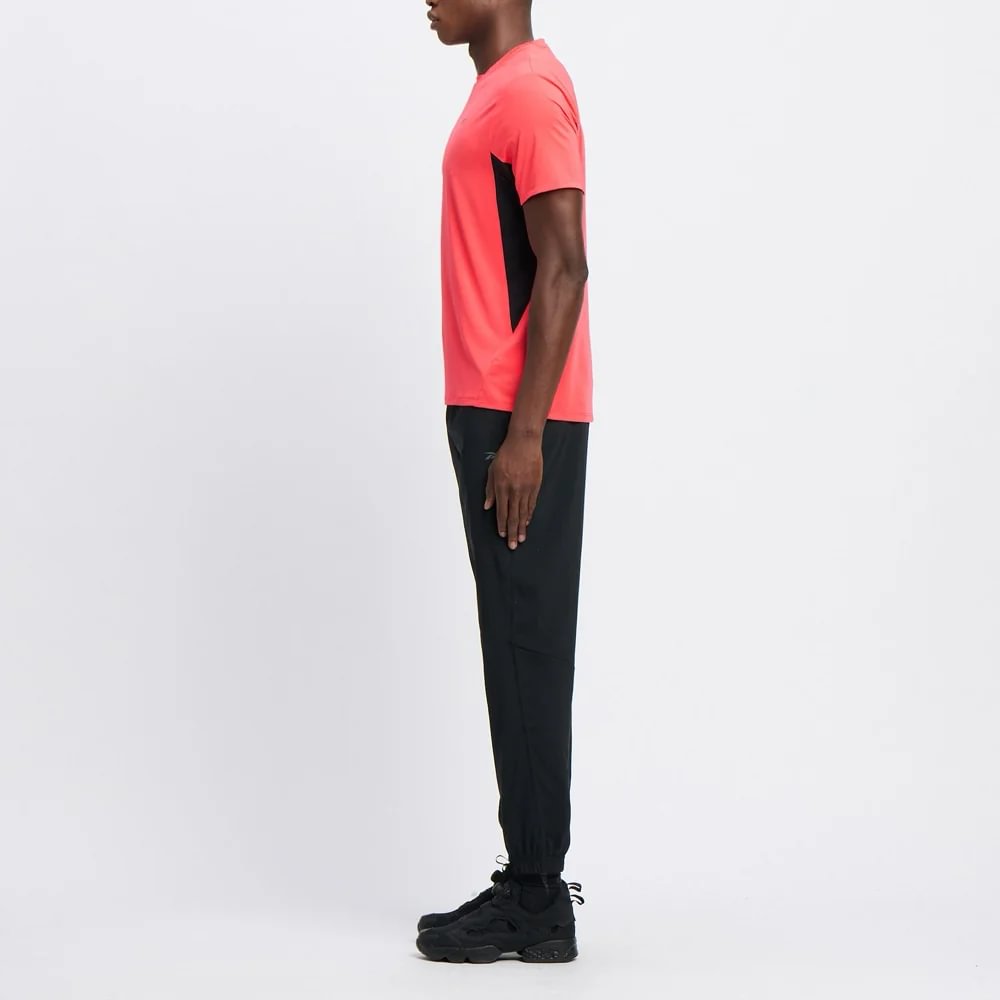 Reebok Id Train Woven Pant Pantalón negro de hombre para entrenamiento