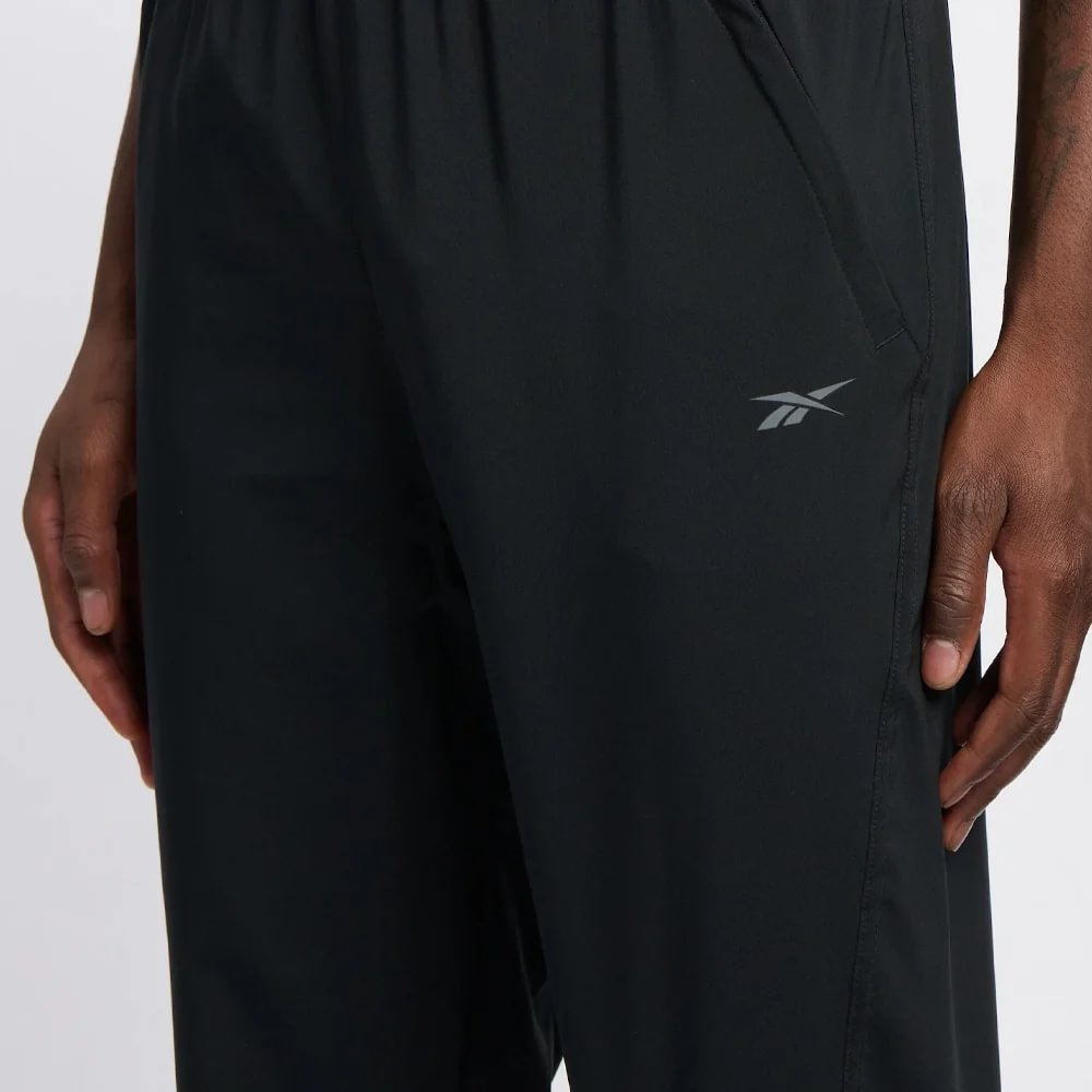 Reebok Id Train Woven Pant Pantalón negro de hombre para entrenamiento