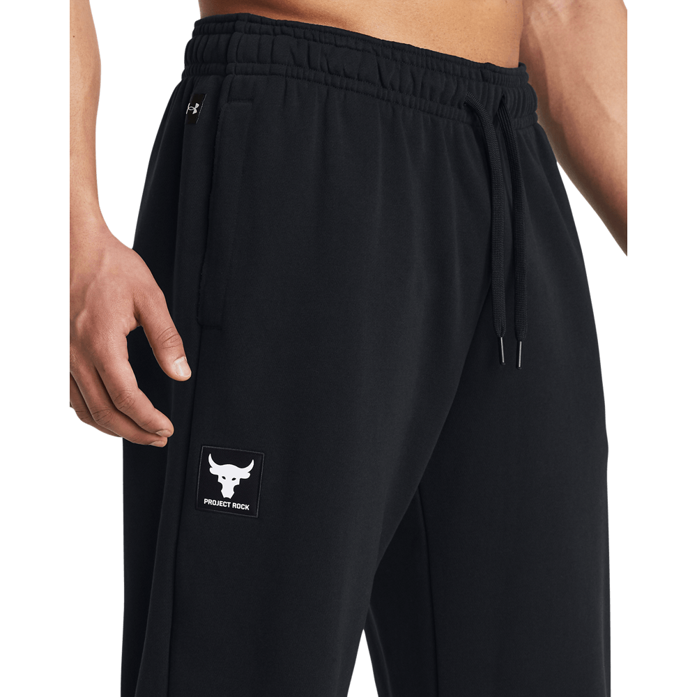 UA  Rock Hwt Terry Jgr Pantalón negro de hombre lifestyle