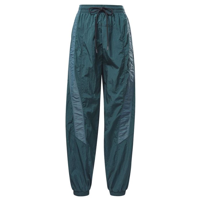 Pantalon-reebok-para-mujer-Sh-Q1-Woven-Pant-para-entrenamiento-color-verde.-Frente-Sin-Modelo